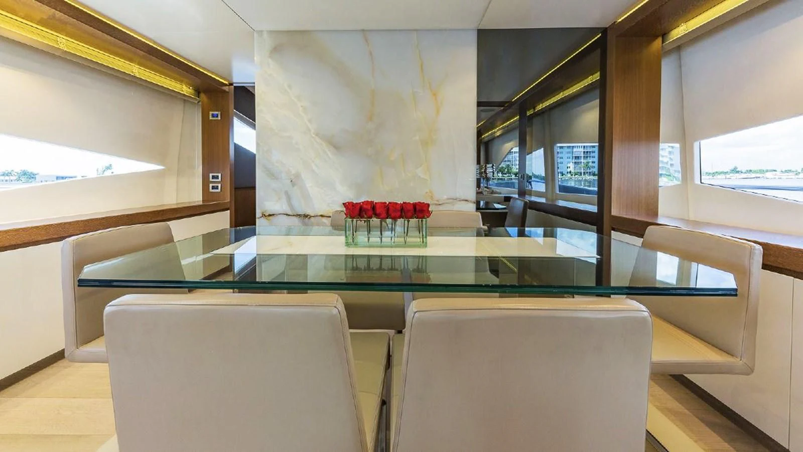 a room with a table and chairs aboard GOLDEN 3 Yacht for Sale