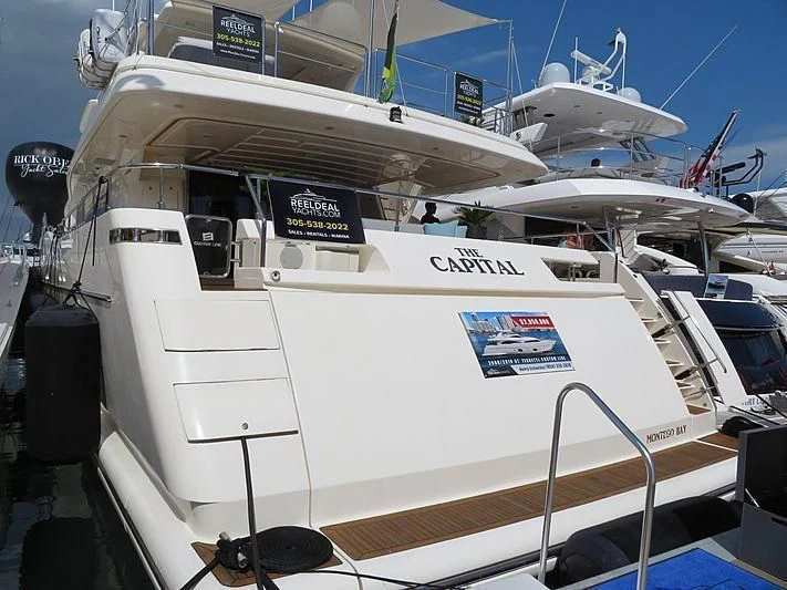 a white boat with a black cap on it aboard PATRON Yacht for Sale