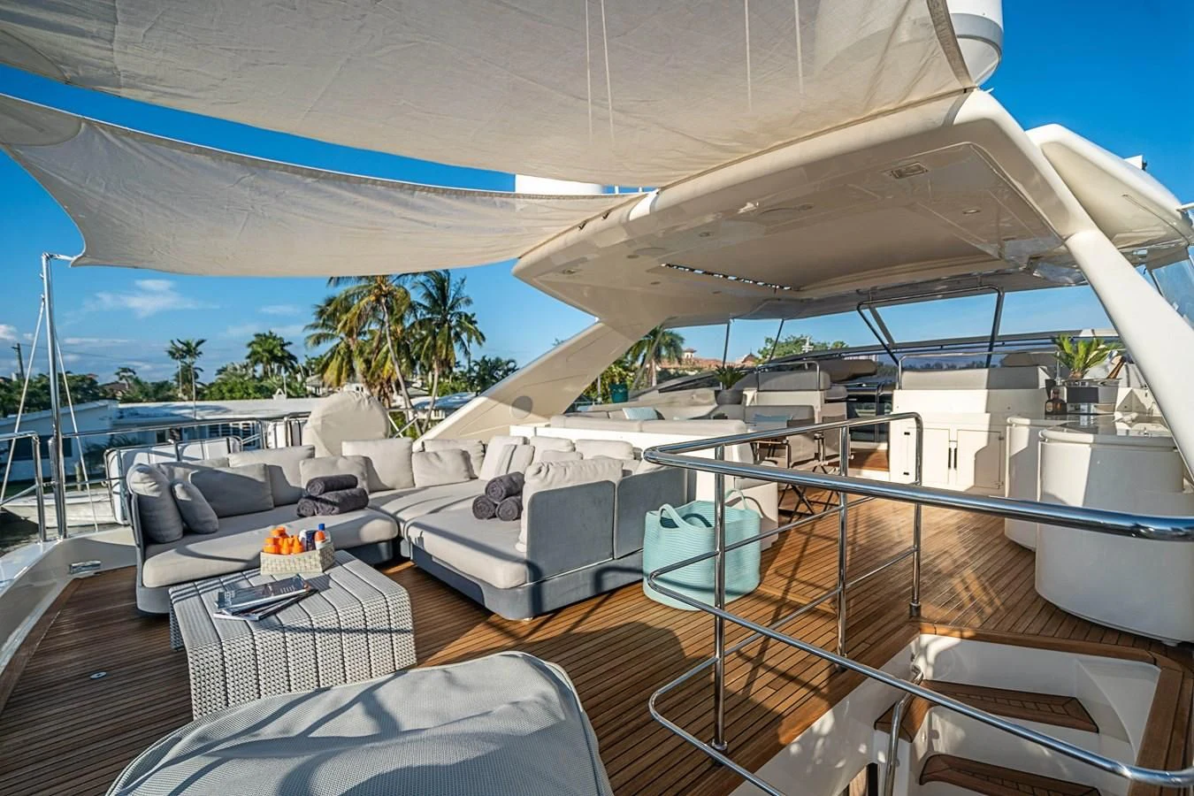 a deck with a couch and a pool aboard PATRON Yacht for Sale