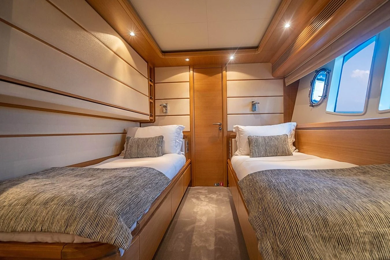 a room with two beds aboard PATRON Yacht for Sale