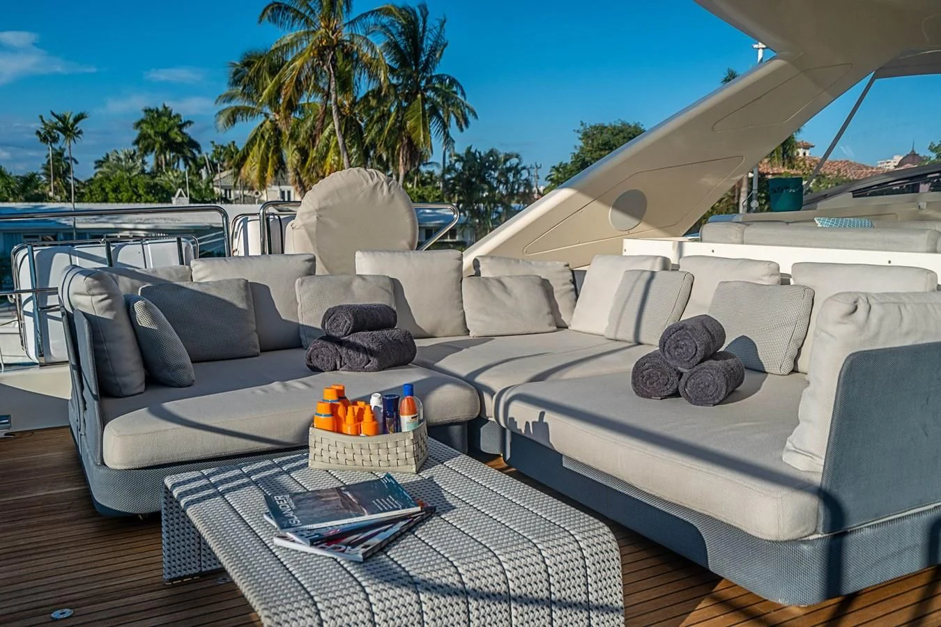 a large white couch with a blue blanket on it aboard PATRON Yacht for Sale
