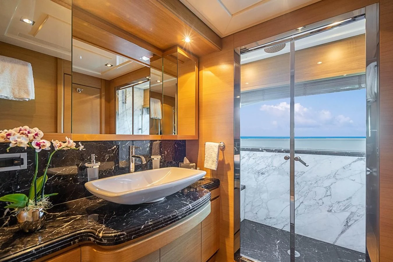 a bathroom with a large window aboard PATRON Yacht for Sale