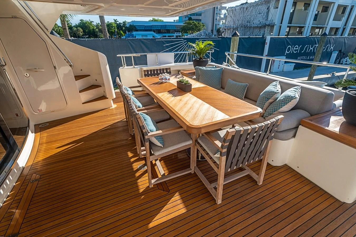 a table and chairs on a deck aboard PATRON Yacht for Sale