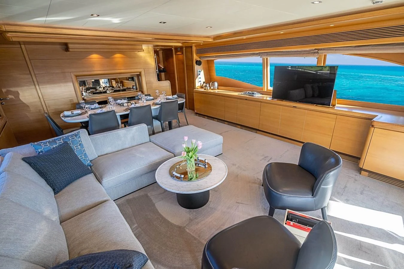 a living room with a large window aboard PATRON Yacht for Sale