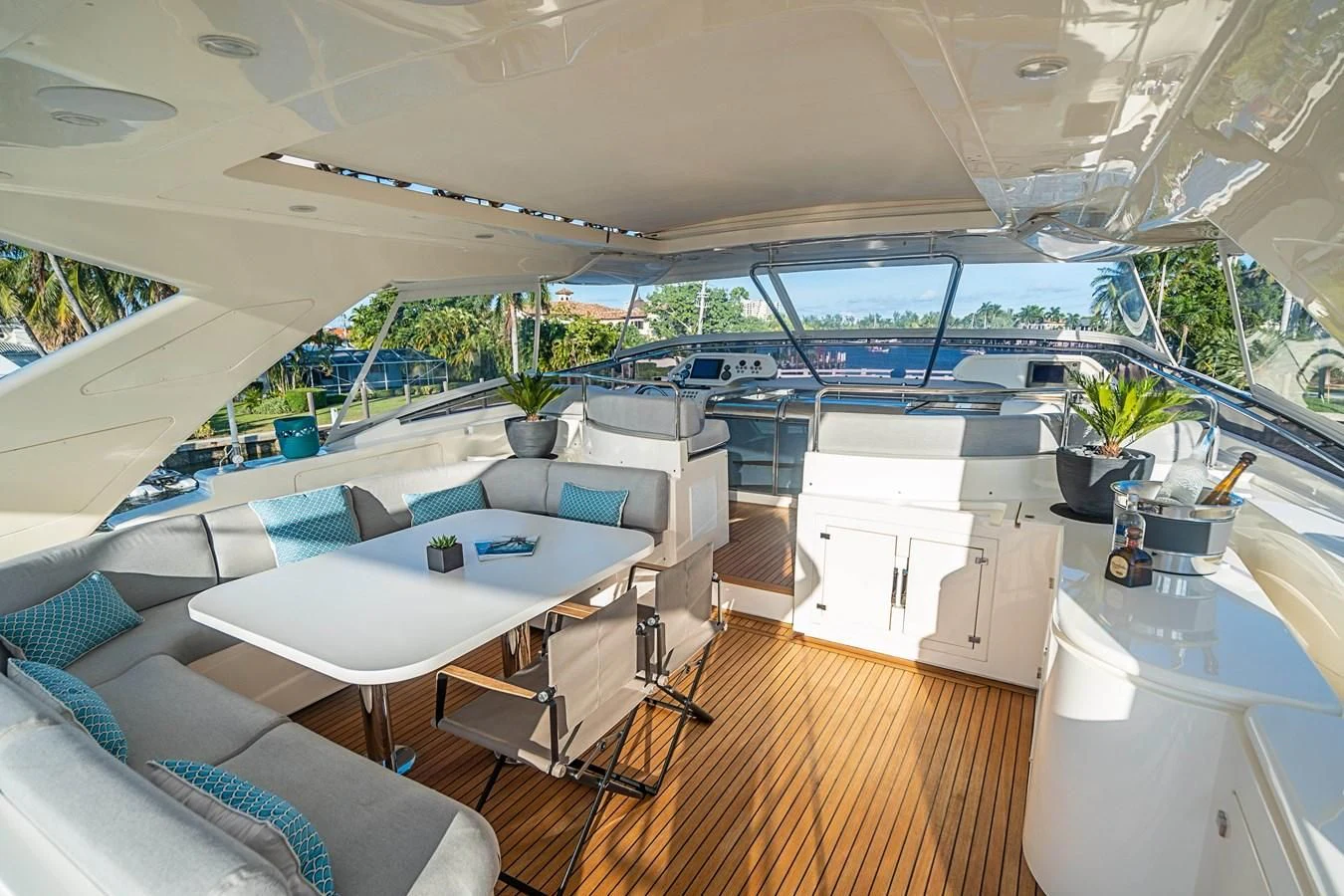 a room with a table and chairs aboard PATRON Yacht for Sale
