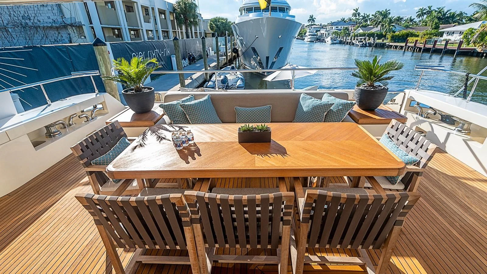 a table on a deck aboard PATRON Yacht for Sale