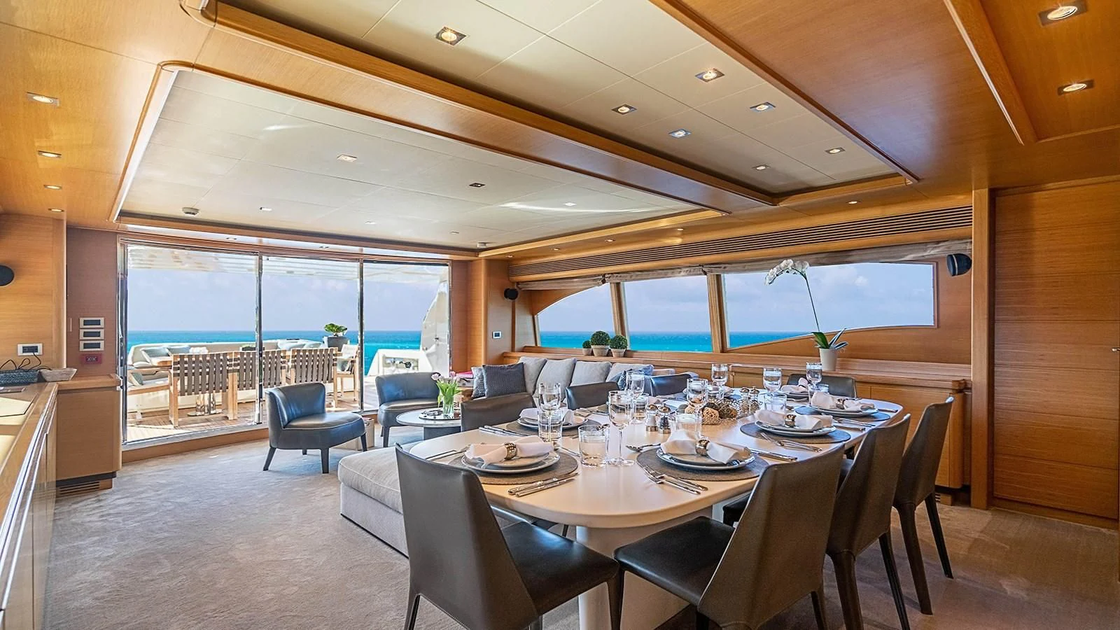 a dining room with a large table aboard PATRON Yacht for Sale
