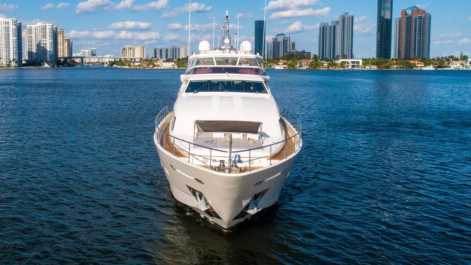 a white yacht in the water aboard PATRON Yacht for Sale