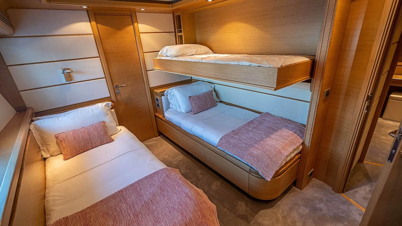 a couple of beds in a room aboard PATRON Yacht for Sale