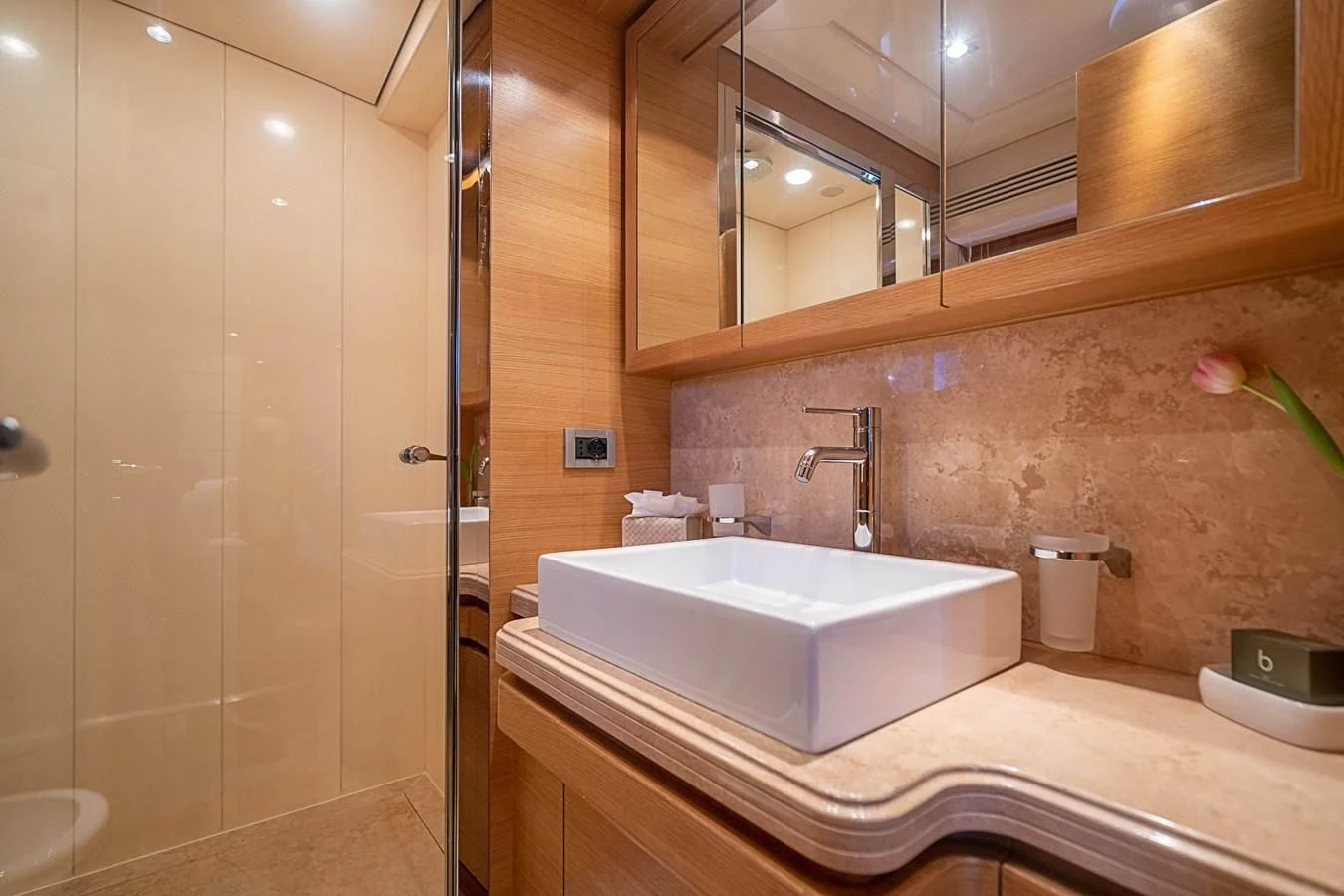 a bathroom with a large mirror aboard PATRON Yacht for Sale