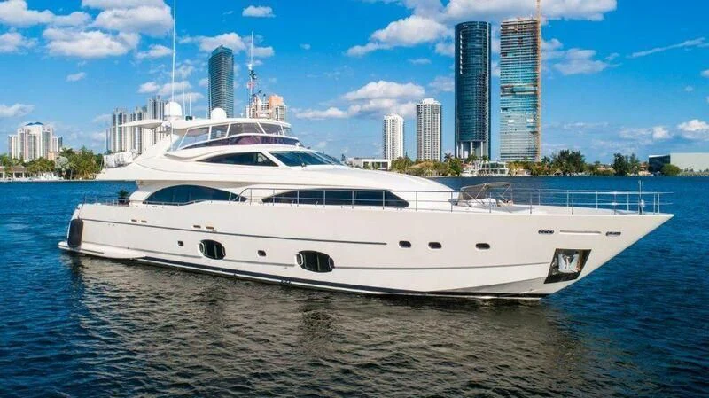 a white yacht on the water aboard PATRON Yacht for Sale