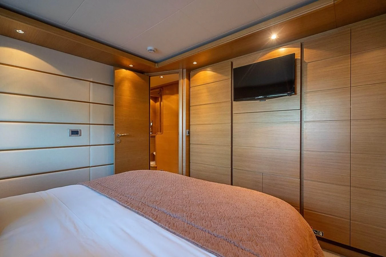 a bed in a room aboard PATRON Yacht for Sale