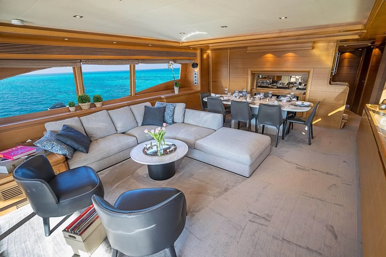 a living room with a couch and a table aboard PATRON Yacht for Sale