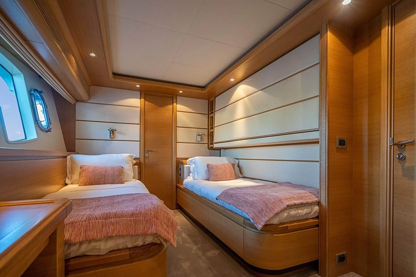a room with two beds aboard PATRON Yacht for Sale