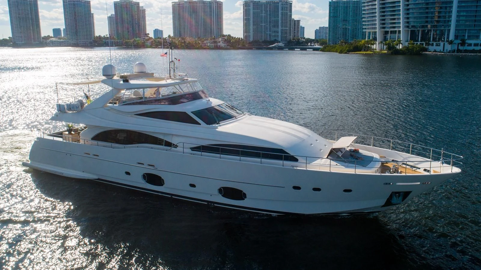 a white yacht on the water aboard PATRON Yacht for Sale