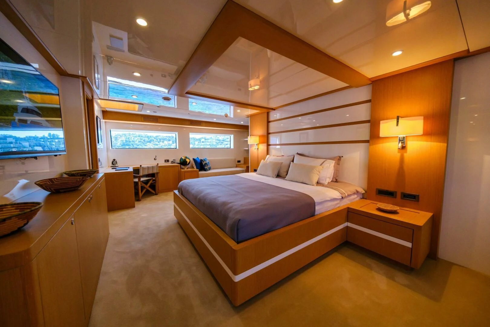 a hotel room with a bed and a desk aboard OTTAWA IV Yacht for Sale