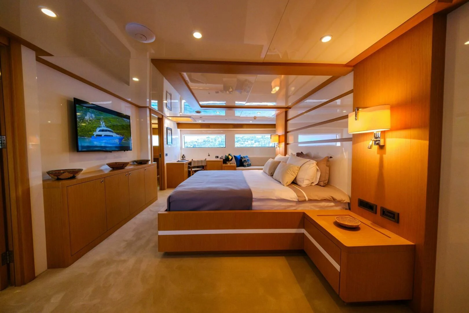 a room with a bed and a tv on the wall aboard OTTAWA IV Yacht for Sale