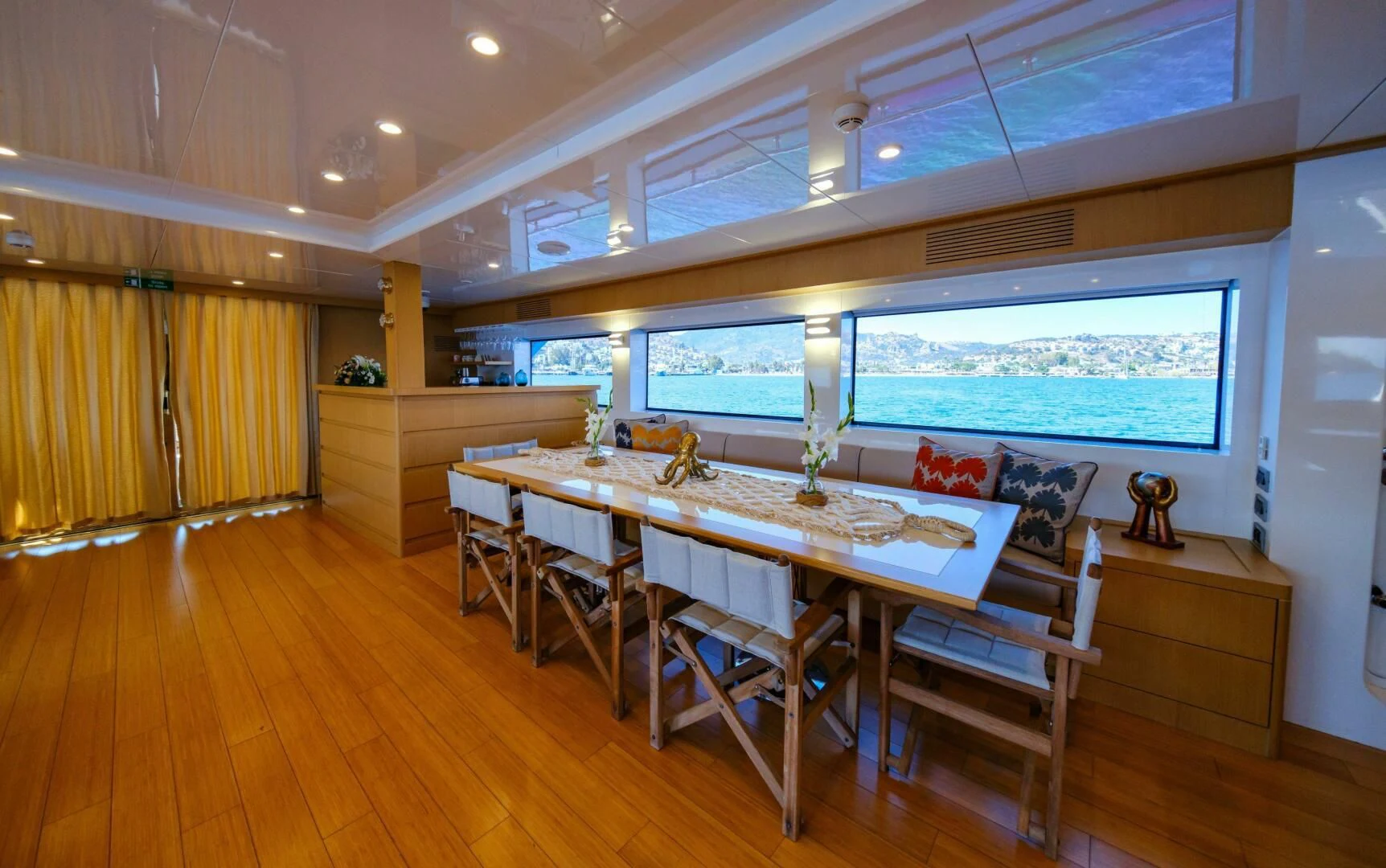 a large dining table in a room aboard OTTAWA IV Yacht for Sale