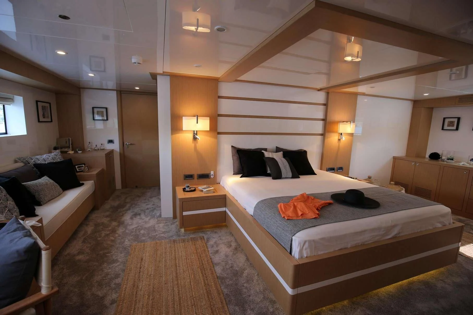 a bedroom with a bed and a couch aboard OTTAWA IV Yacht for Sale