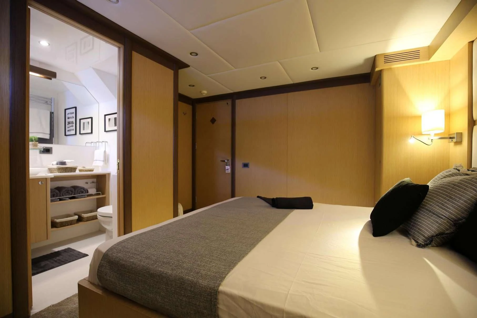 a bedroom with a bed and a desk aboard OTTAWA IV Yacht for Sale