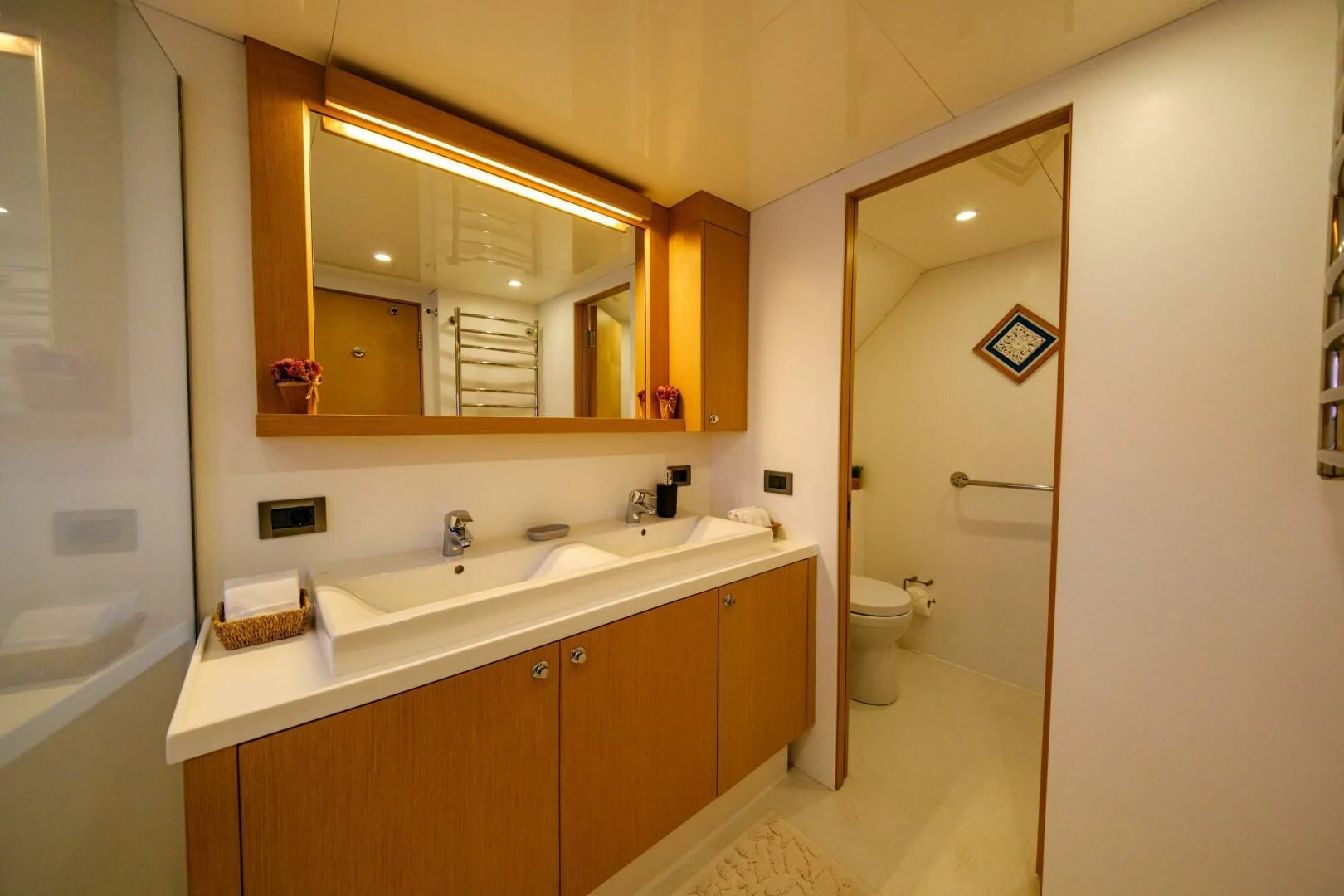 a bathroom with a large mirror aboard OTTAWA IV Yacht for Sale