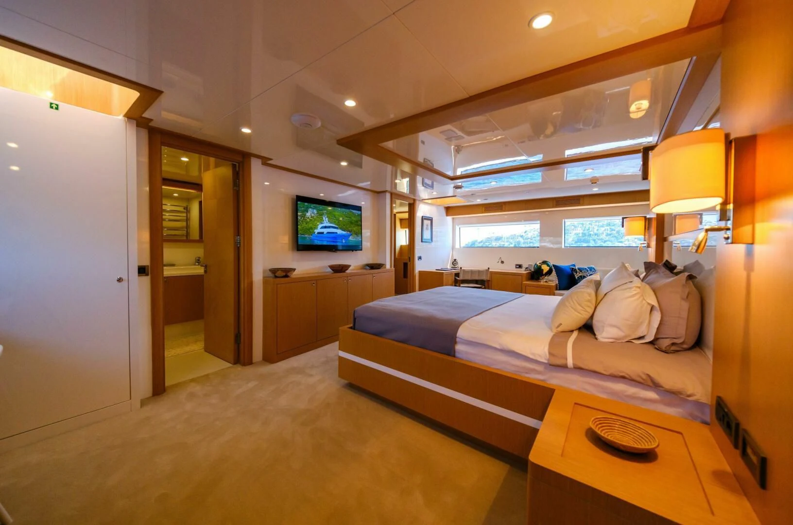 a room with a bed and a tv on the wall aboard OTTAWA IV Yacht for Sale