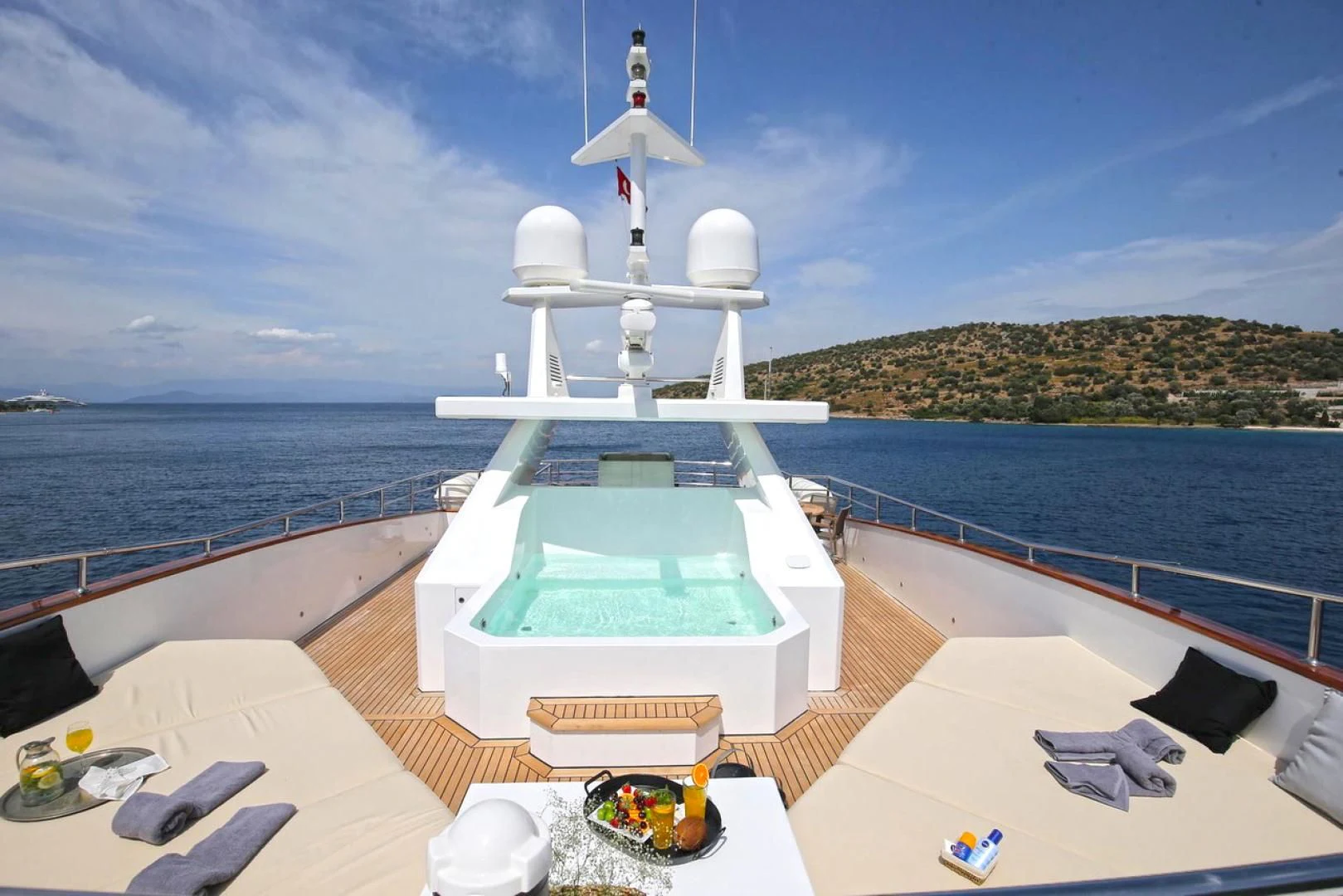 a pool on a deck overlooking the ocean aboard OTTAWA IV Yacht for Sale