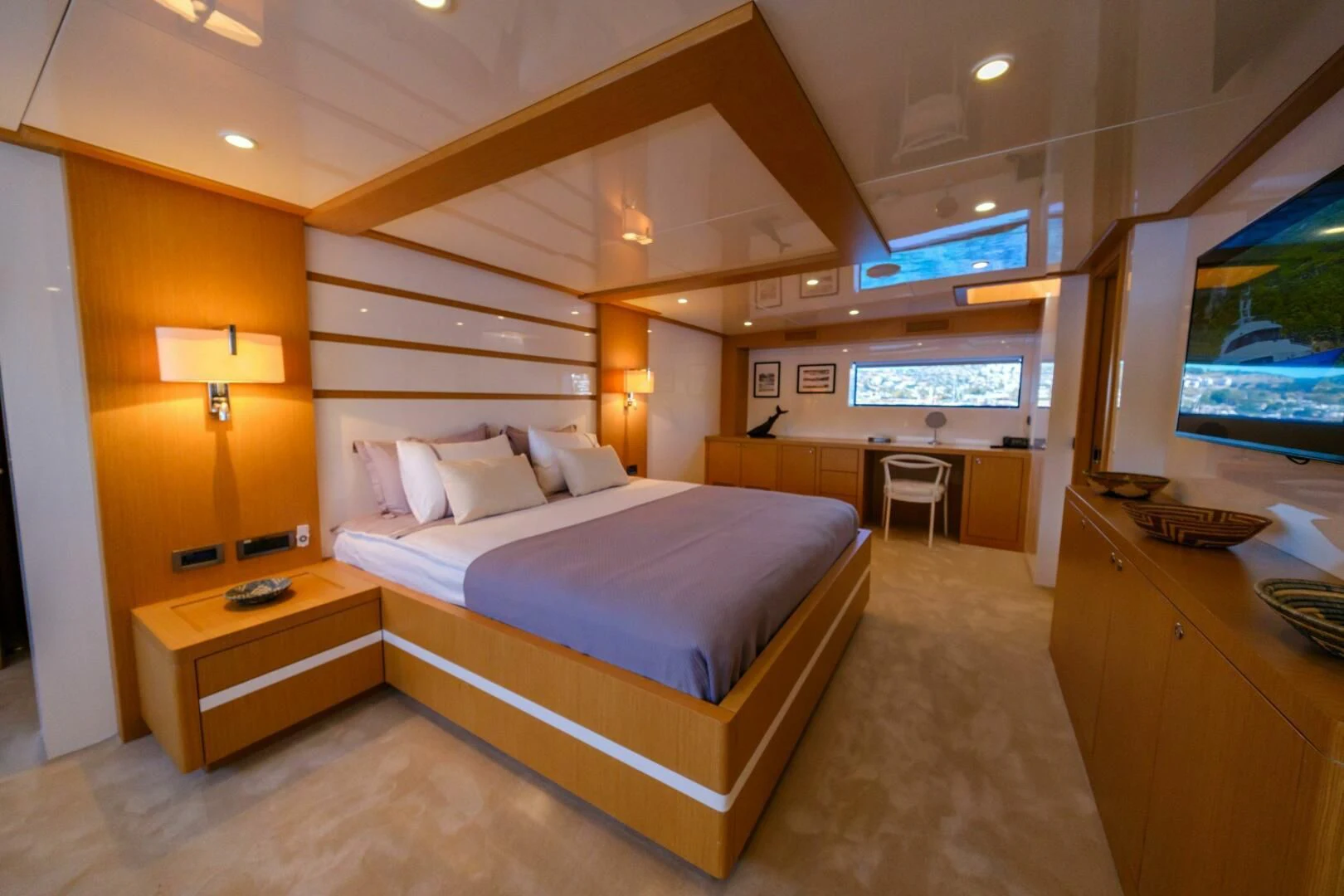 a hotel room with a bed and a tv aboard OTTAWA IV Yacht for Sale
