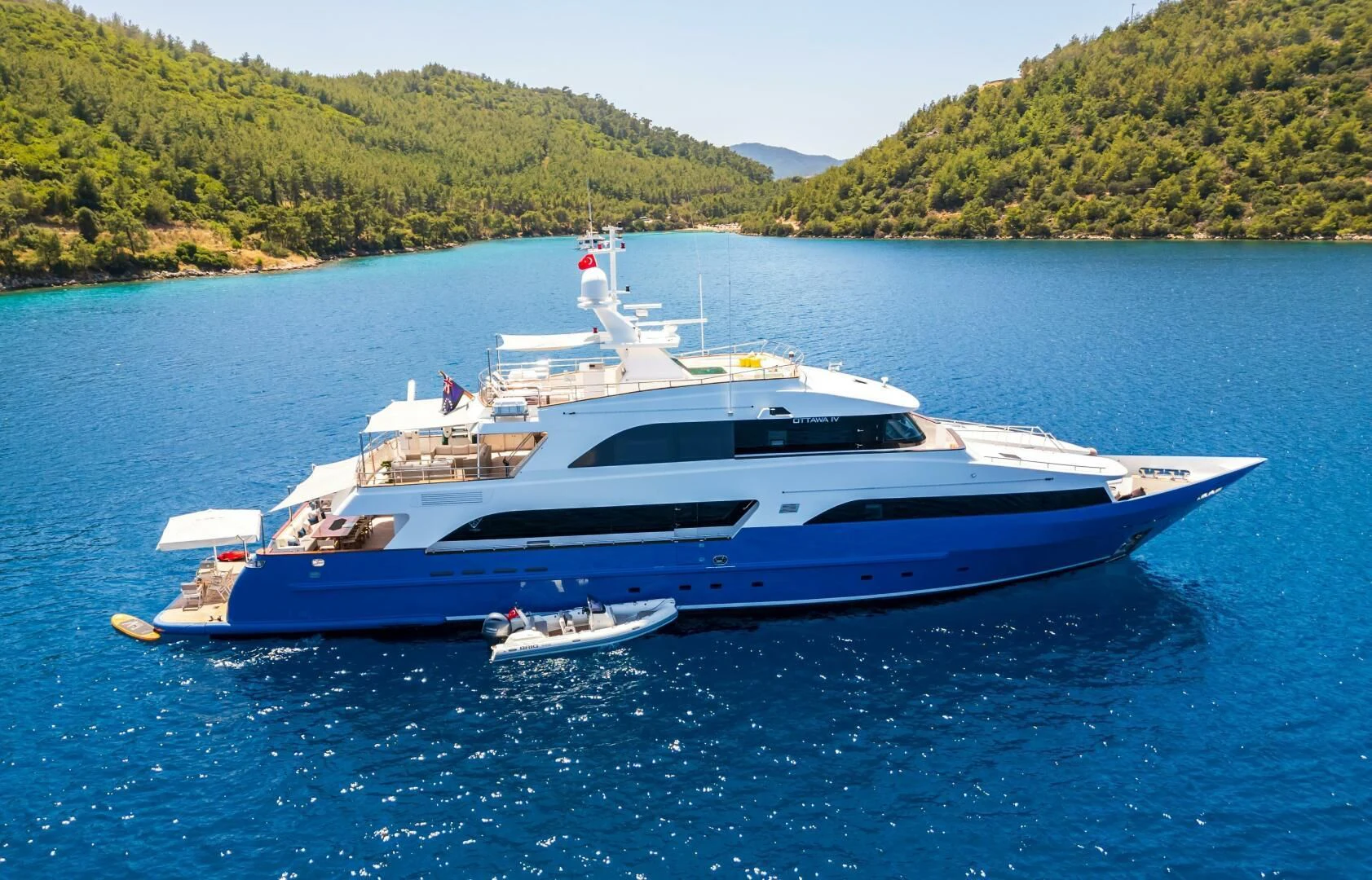 a large yacht on the water aboard OTTAWA IV Yacht for Sale