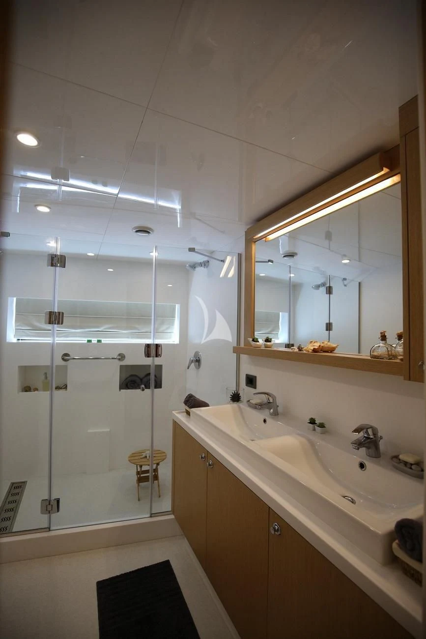 a bathroom with a large mirror aboard OTTAWA IV Yacht for Sale