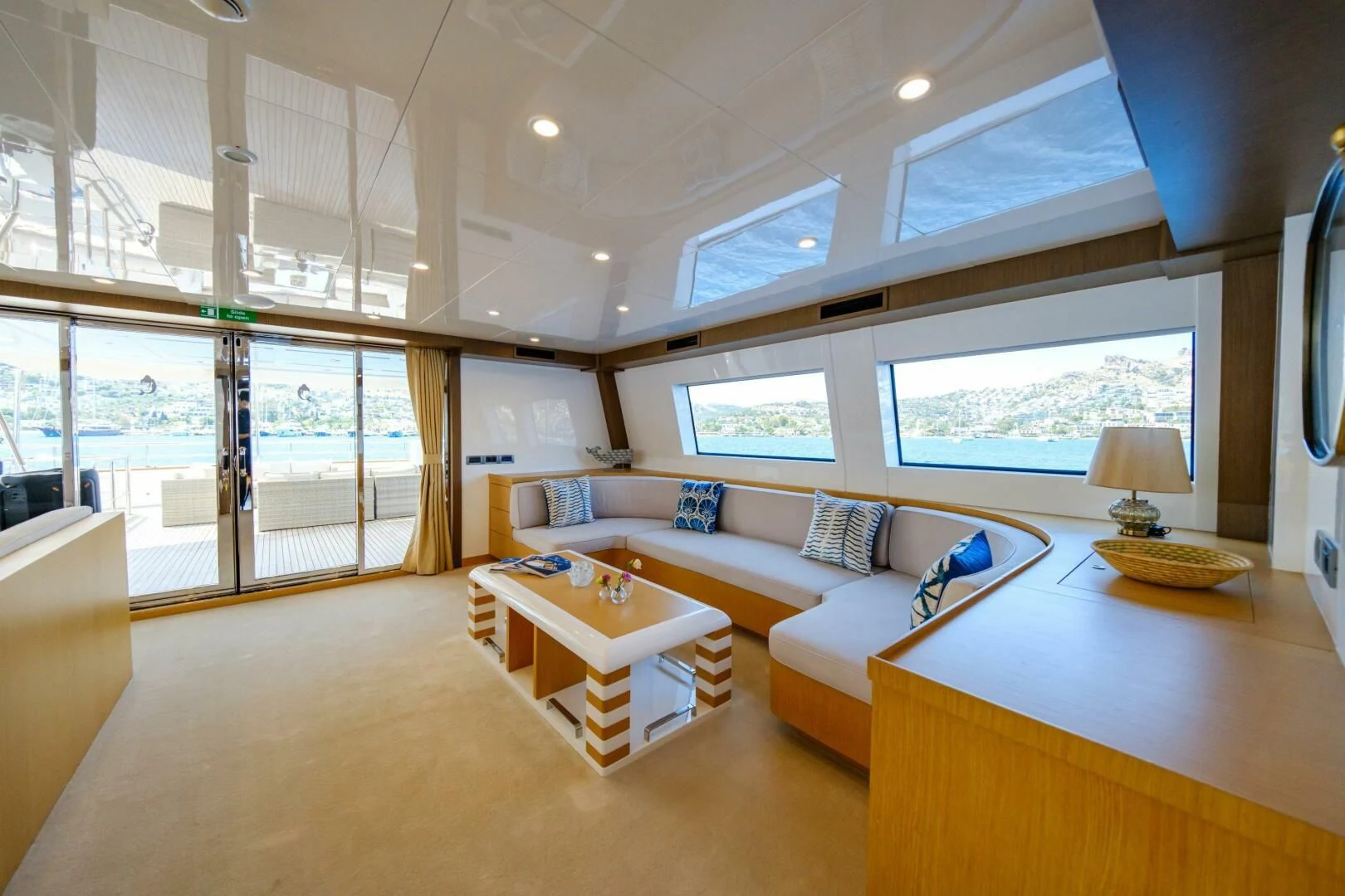 a living room with a couch and a table aboard OTTAWA IV Yacht for Sale
