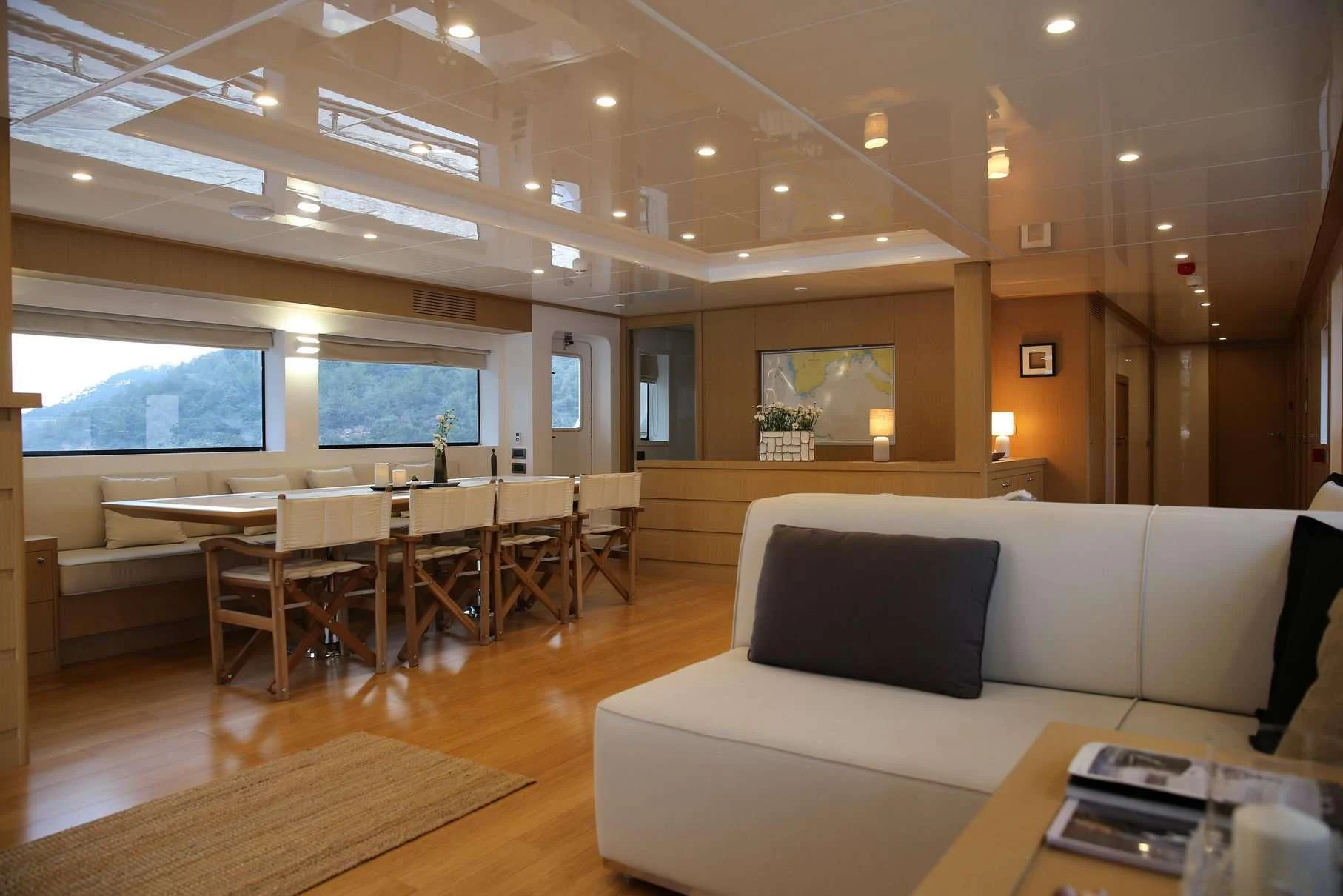 a living room with a couch and a table aboard OTTAWA IV Yacht for Sale