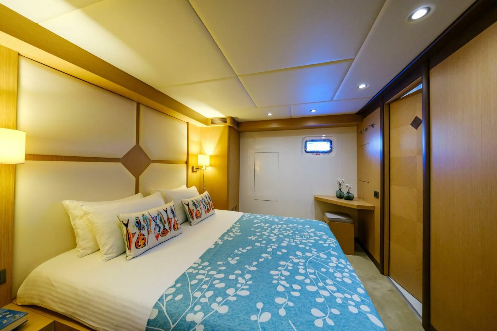a bed with blue and white sheets aboard OTTAWA IV Yacht for Sale