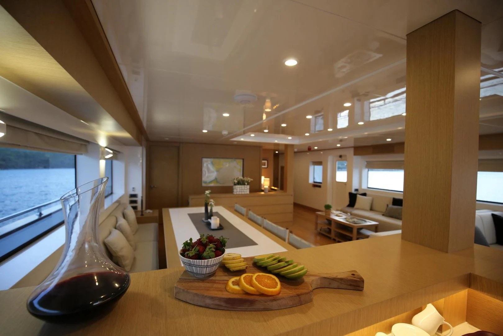a large room with a table and chairs and a large window aboard OTTAWA IV Yacht for Sale