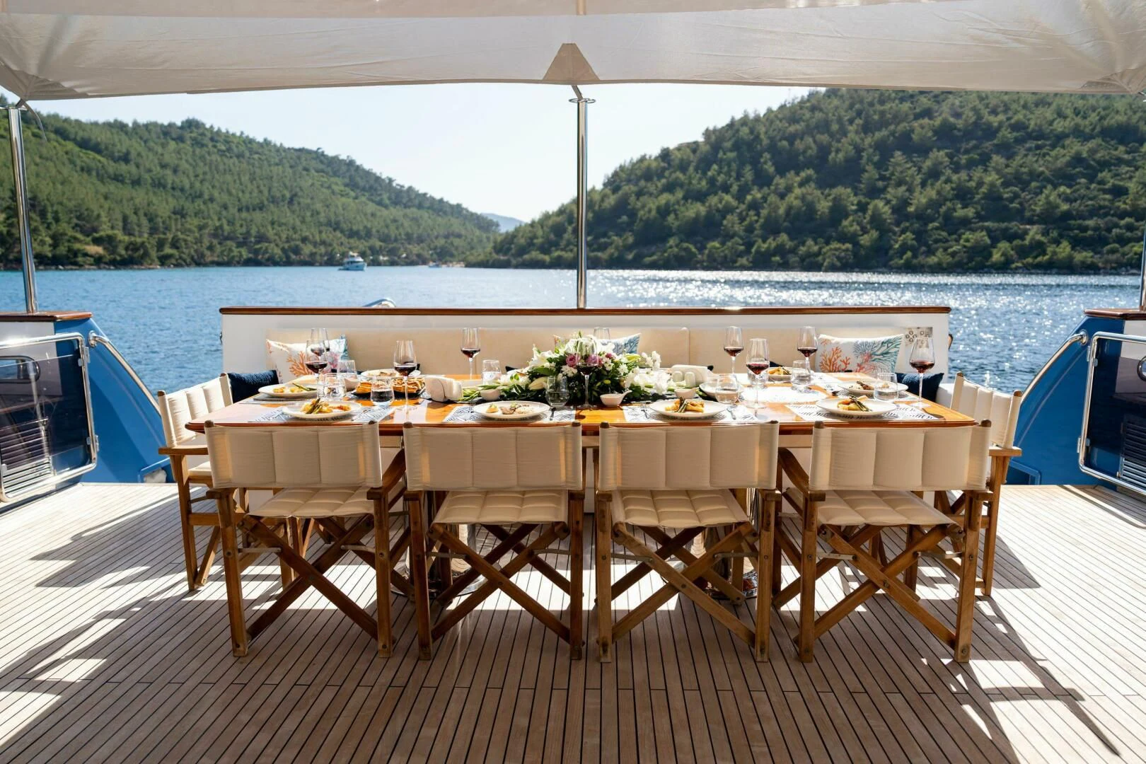 a table set for a meal on a boat aboard OTTAWA IV Yacht for Sale
