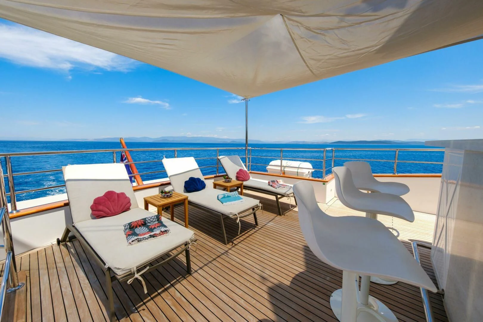 a room with a bed and a table and chairs aboard OTTAWA IV Yacht for Sale