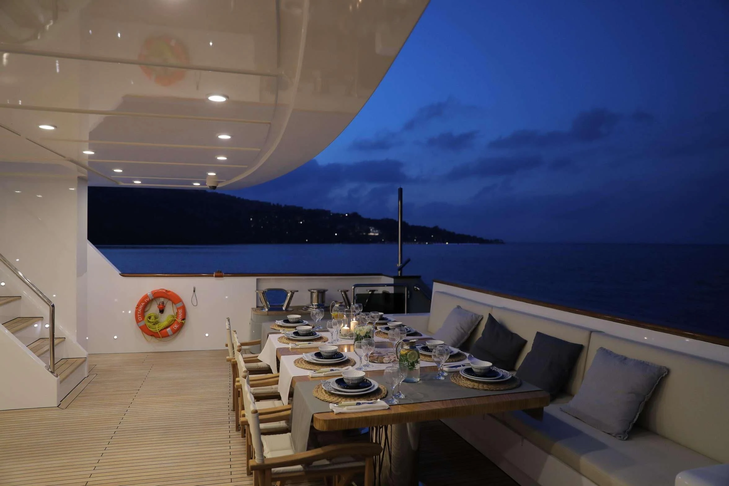 a large room with a table and chairs aboard OTTAWA IV Yacht for Sale