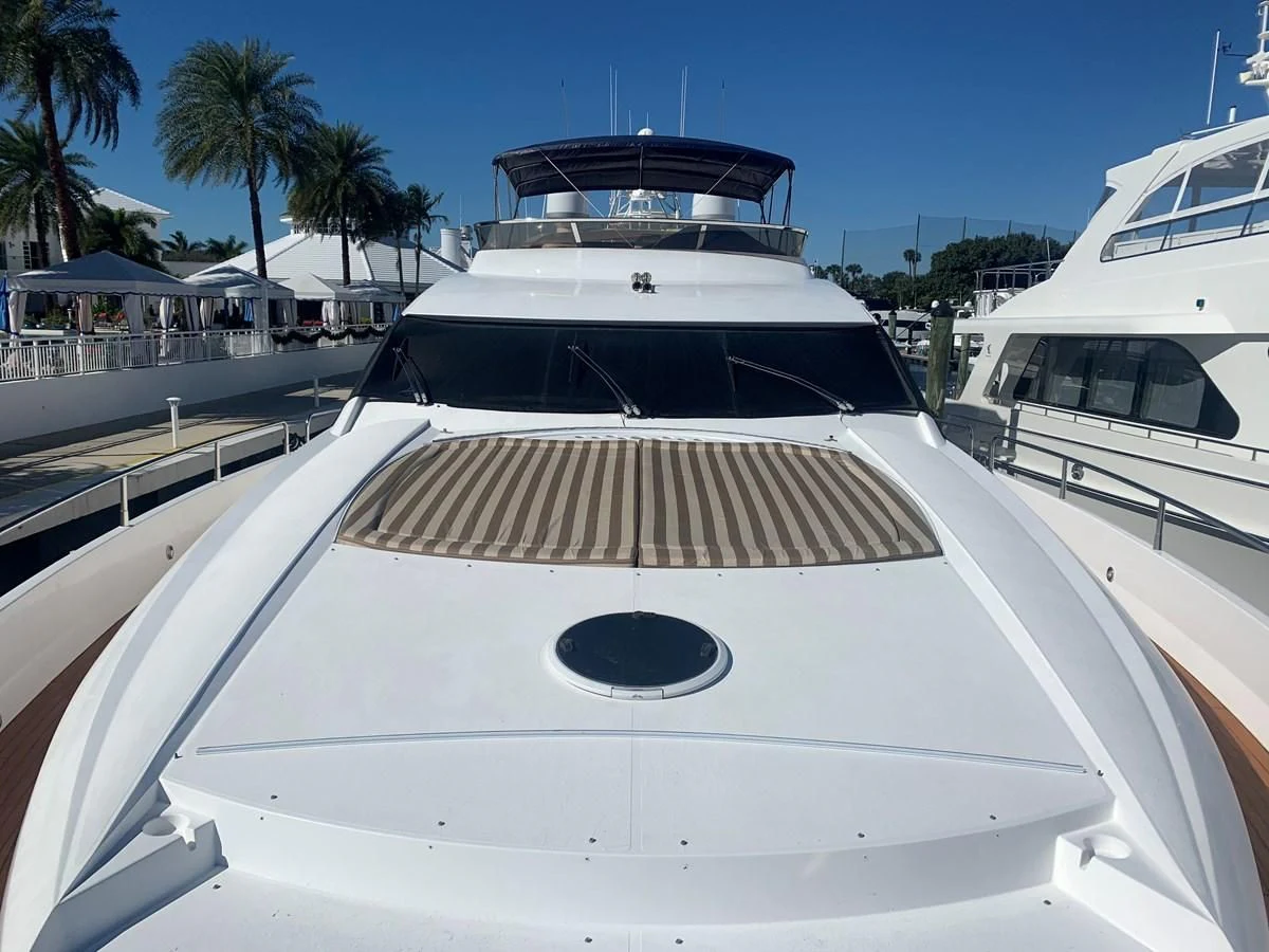 a white yacht on a dock aboard MY MEDICINE Yacht for Sale