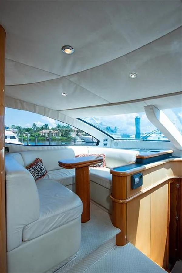 a boat with a table and a bench on a boat aboard MY MEDICINE Yacht for Sale