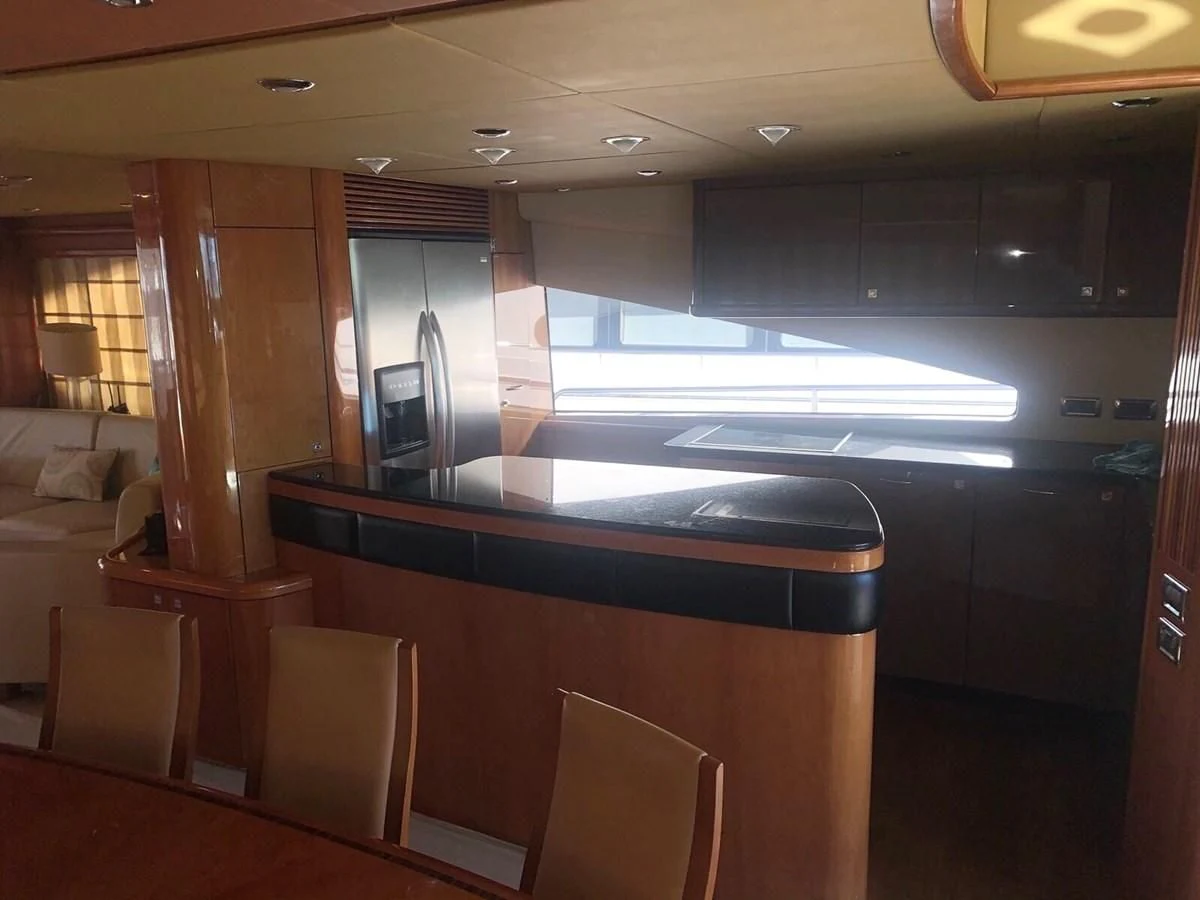 a room with a large counter and chairs aboard MY MEDICINE Yacht for Sale