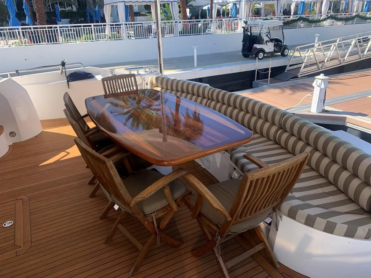 a table with chairs around it aboard MY MEDICINE Yacht for Sale