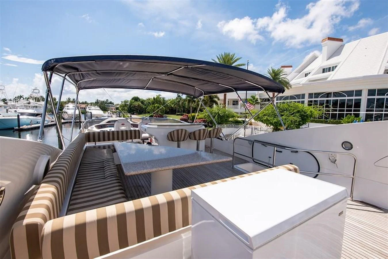 a deck with a covered patio and a large umbrella aboard MY MEDICINE Yacht for Sale
