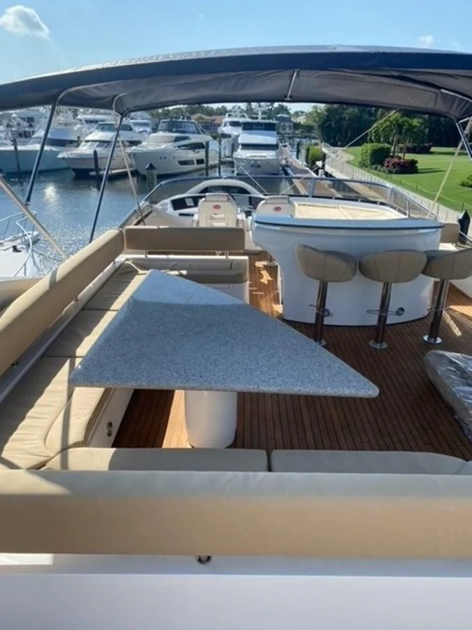 a table with chairs on it aboard MY MEDICINE Yacht for Sale