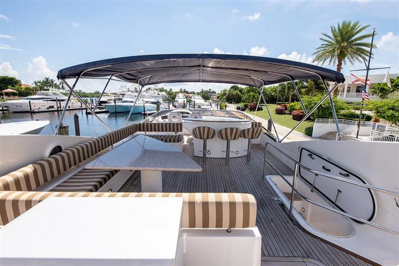 a deck with a large umbrella aboard MY MEDICINE Yacht for Sale