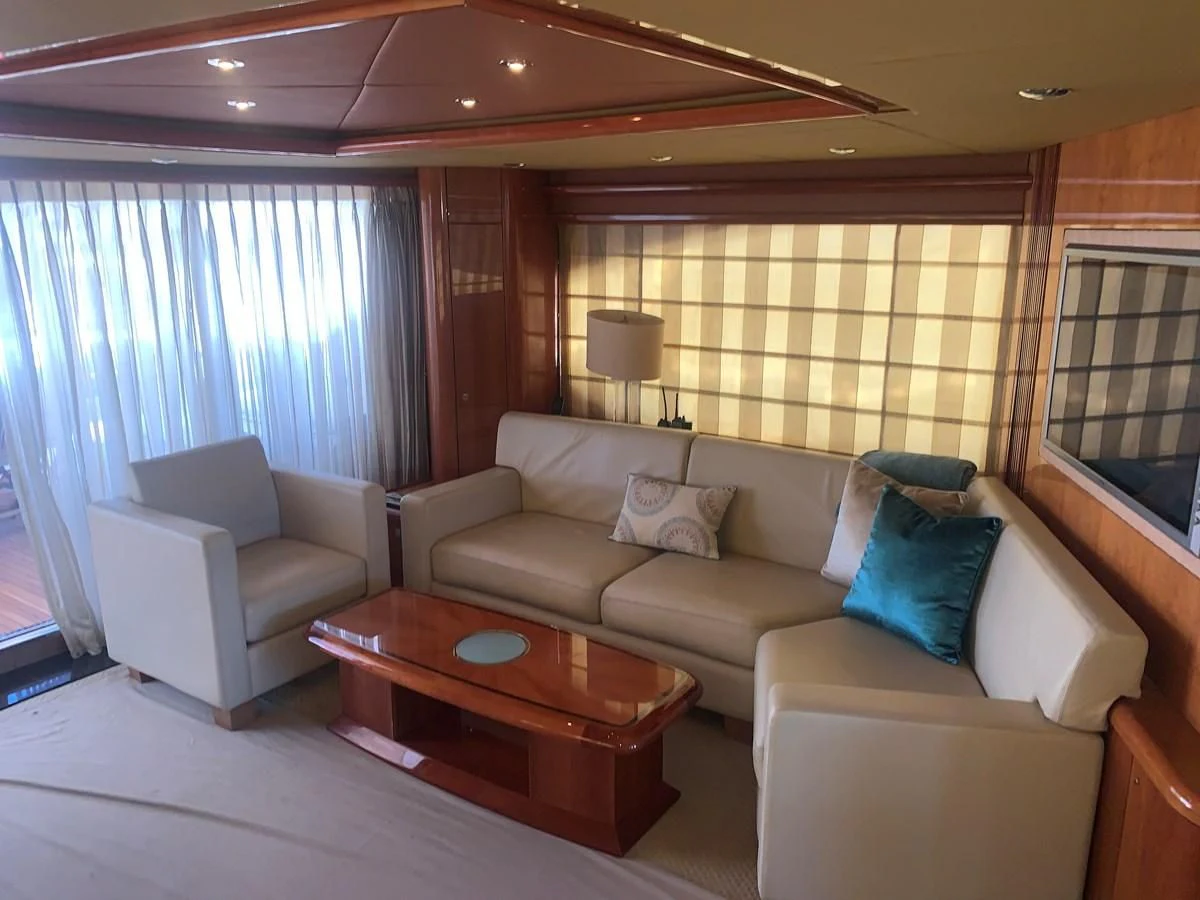 a living room with a couch and a coffee table aboard MY MEDICINE Yacht for Sale