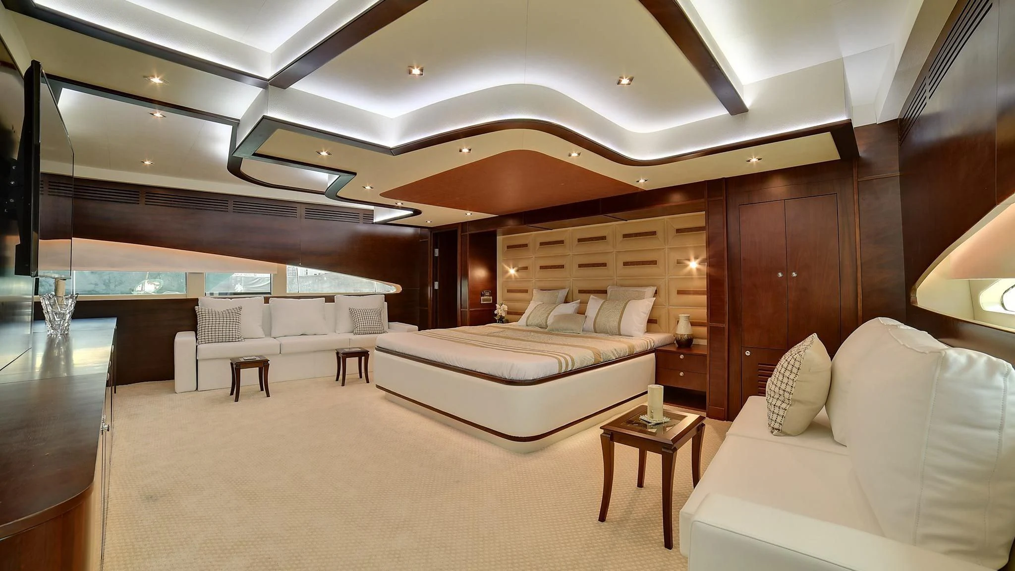 a room with a bed and a table aboard STARDOM Yacht for Sale