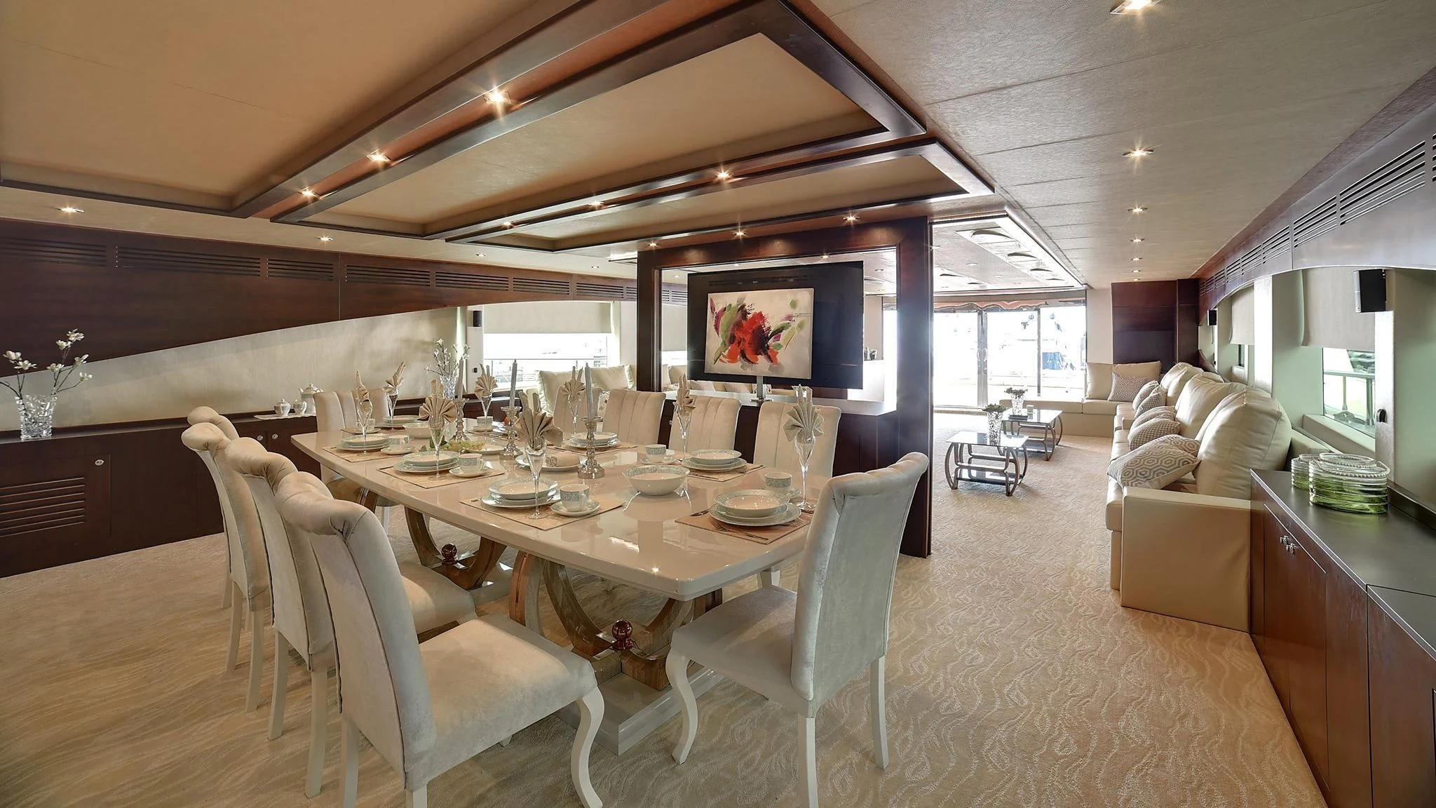 a dining room with a table and chairs aboard STARDOM Yacht for Sale