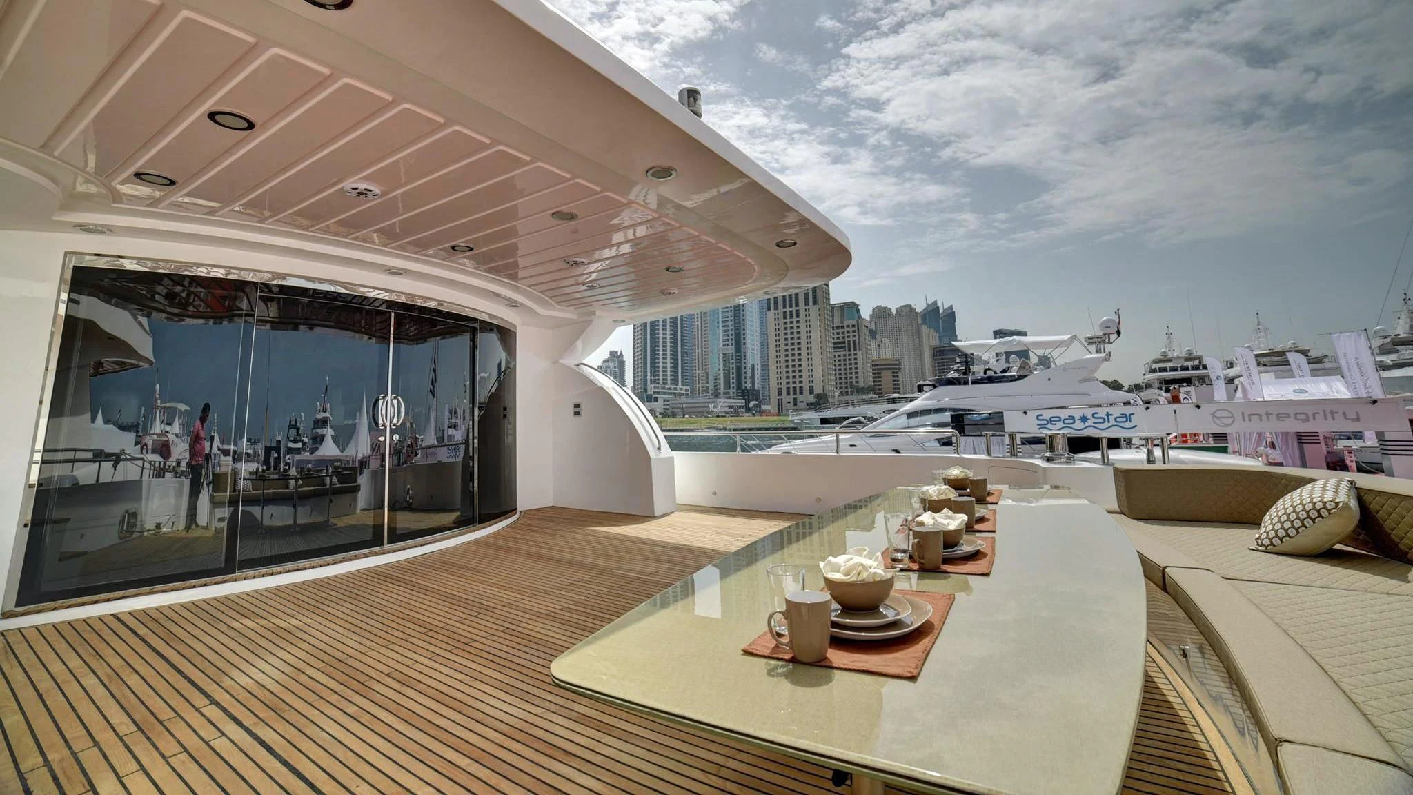 a room with a table and a view of the water aboard STARDOM Yacht for Sale