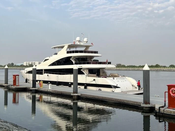 a boat docked at a pier aboard STARDOM Yacht for Sale