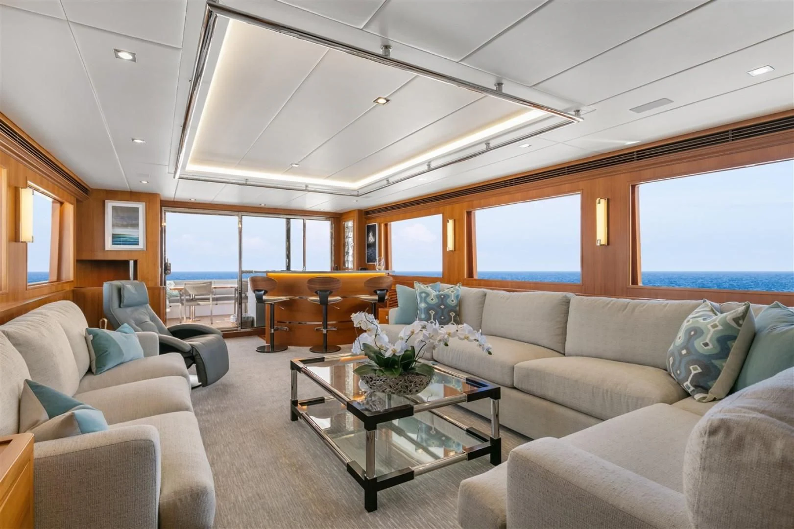 a living room with a couch and a coffee table aboard BLUE CHIP Yacht for Sale